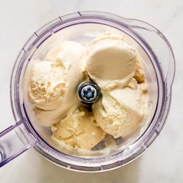 Vanilla ice cream and milk in a blender.