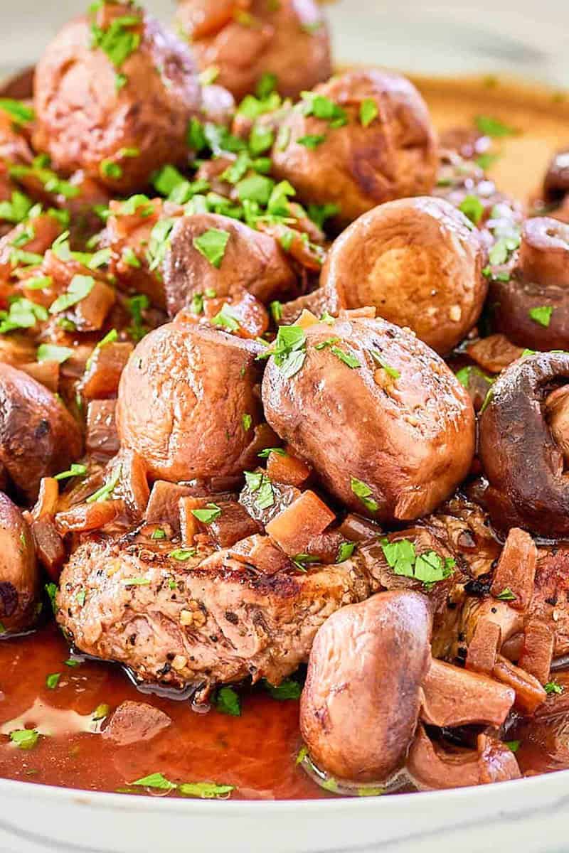 Closeup of copycat Outback Steakhouse sauteed mushrooms on a plate.