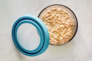 Oats and milk in a container.