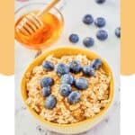 A bowl of overnight oats made with milk and a bowl of honey.