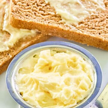Copycat Saltgrass Steakhouse honey butter in a bowl and on bread slices.