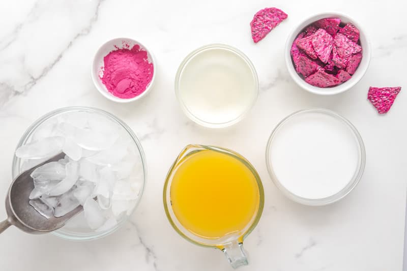 Copycat Starbucks dragon drink ingredients on a marble surface.