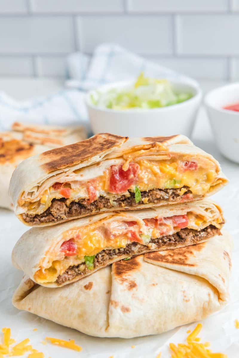 Copycat Taco Bell crunchwrap supreme on a marble surface.