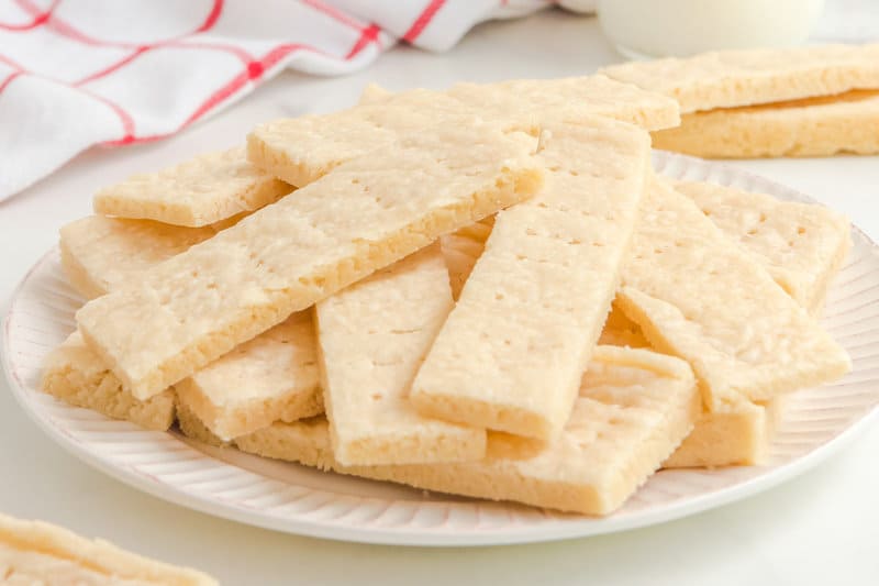 Copycat Walkers shortbread cookies piled on a white plate.