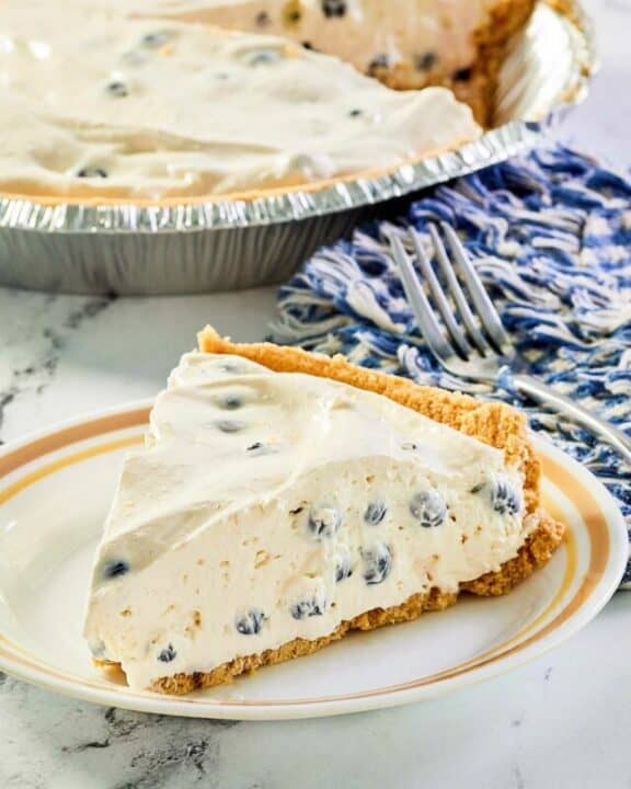 No bake fresh blueberry cream pie slice on a plate.