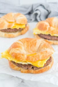 Three copycat Burger King sausage egg and cheese croissan'wich breakfast sandwiches.