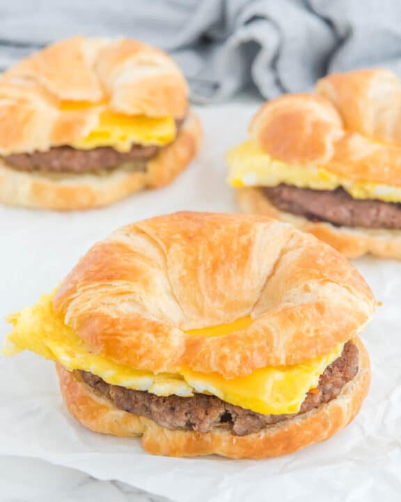 Three copycat Burger King sausage egg and cheese croissan'wich breakfast sandwiches.