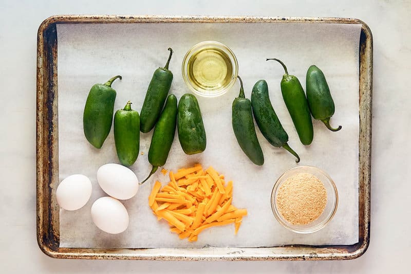 Cheddar cheese jalapeno poppers ingredients on a tray.