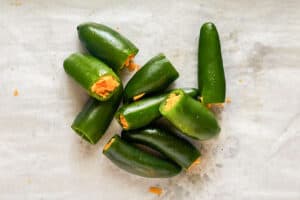 Fresh jalapeno peppers stuffed with cheddar cheese.