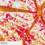 Closeup of cherry dessert pizza slices.