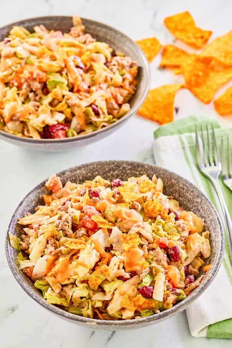 Dorito taco salad in two bowls.