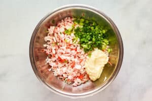 Imitation crab salad ingredients in a mixing bowl.