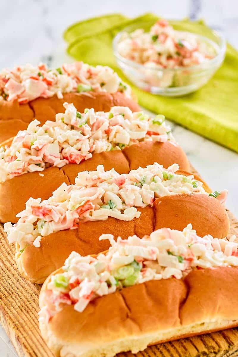 Imitation crab salad in four hoagie rolls.