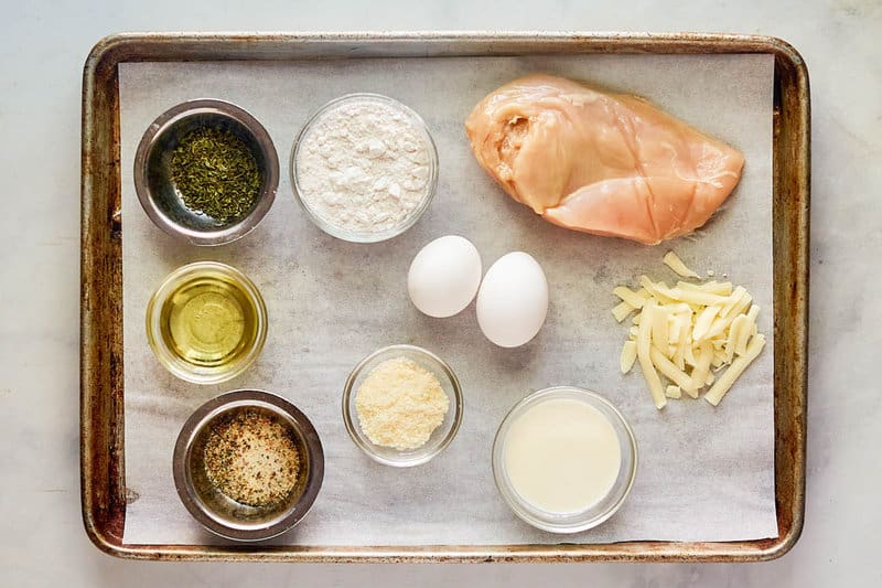 Copycat Luby's Italian chicken breast ingredients on a tray.