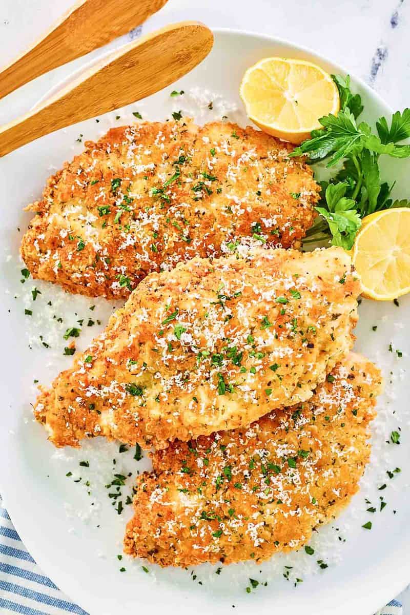 Overhead view of copycat Luby's Italian chicken breast on a platter.