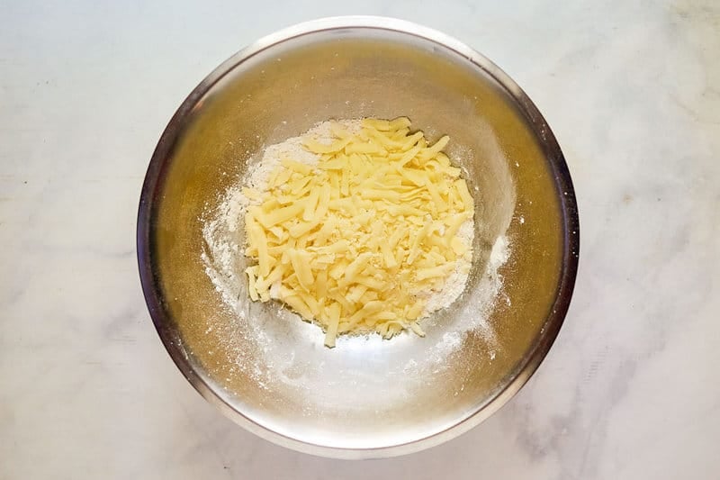 Cheese and flour in a bowl.