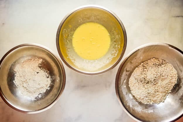 Breading station for Italian chicken breast.