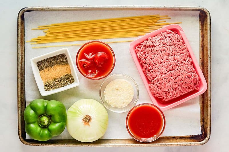 Spaghetti meat sauce ingredients on a tray.