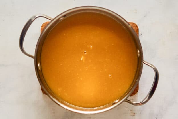 Homemade sweet hot mustard in a saucepan.
