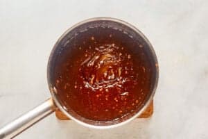 Spicy Thai peanut sauce in a saucepan.