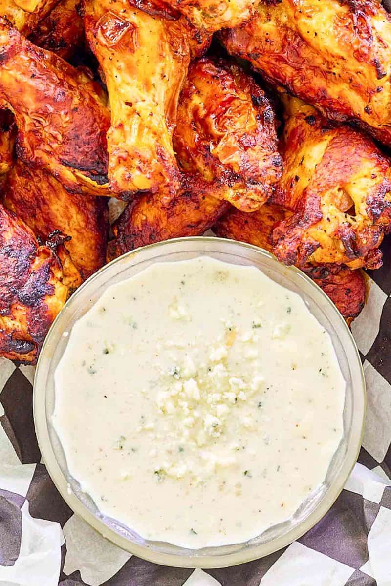 Overhead view of copycat Wingstop blue cheese dip and chicken wings.