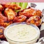 A small bowl of homemade Wingstop blue cheese dip and chicken wings.
