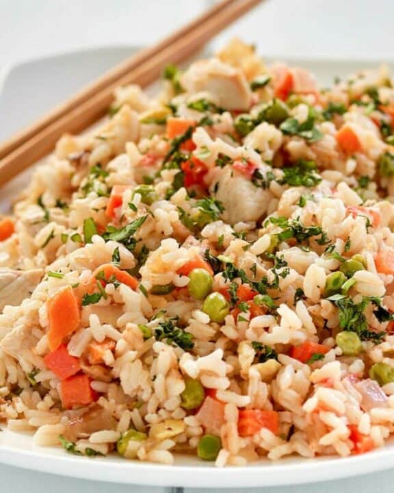 Thai fried rice with chicken on a plate.