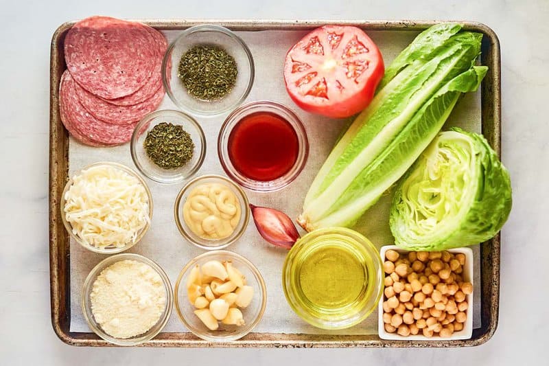 Copycat California Pizza Kitchen Italian chopped crockery   ingredients connected  a tray.