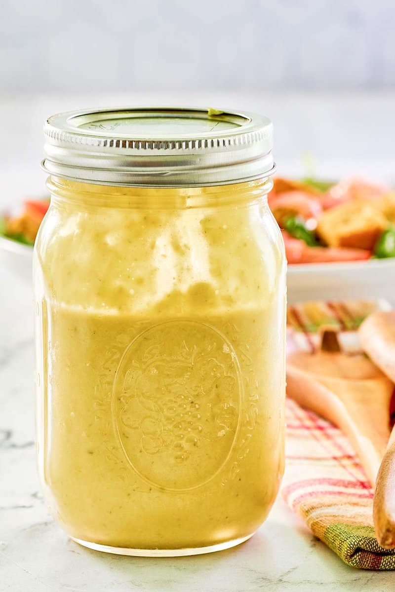 Green onion salad dressing in a mason jar.