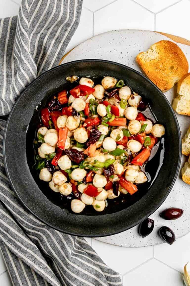 Overhead view of homemade marinated mozzarella balls.