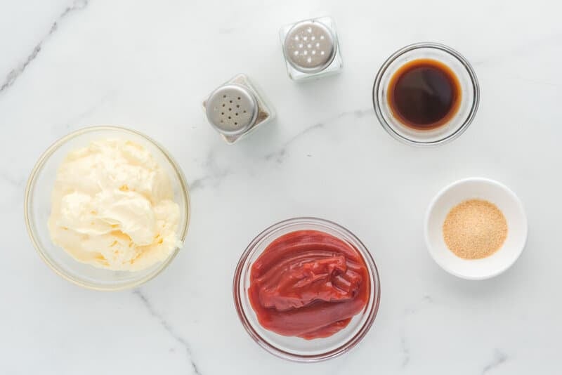 Copycat Raising Cane's sauce ingredients on a marble surface.