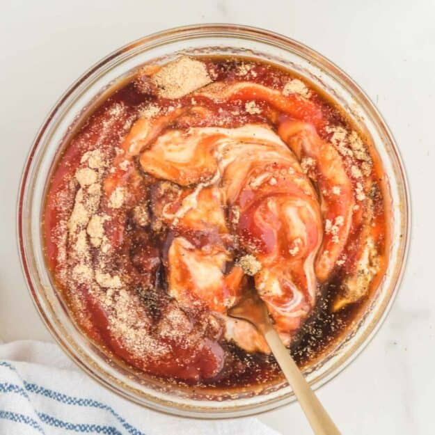 Stirring ingredients together to make copycat Raising Cane's sauce.