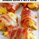 Closeup of air fryer bacon wrapped cheese stuffed jalapeno poppers on a platter.