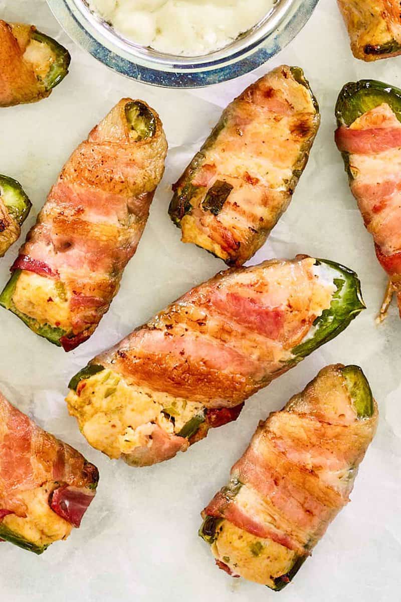 Overhead view of bacon wrapped buffalo chicken jalapeno poppers.