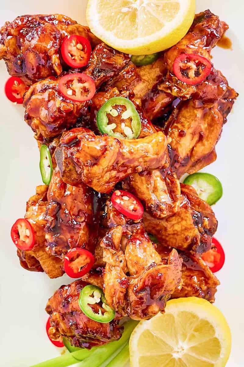 Overhead view of copycat Buffalo Wild Wings Asian Zing wings on a white plate.