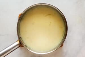 Milk and yellow goop in a saucepan.