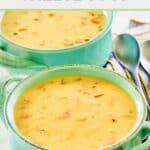 Cheddar cheese soup and spoons.