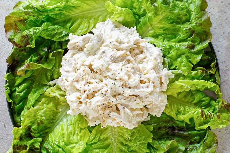 Copycat Chicken Salad Chick Classic Carol chicken salad served over lettuce.