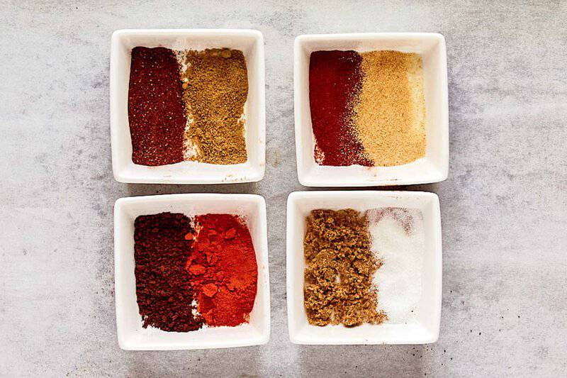 Homemade coffee rub ingredients in square bowls.