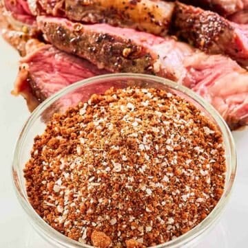 Homemade coffee rub and steak on a platter.