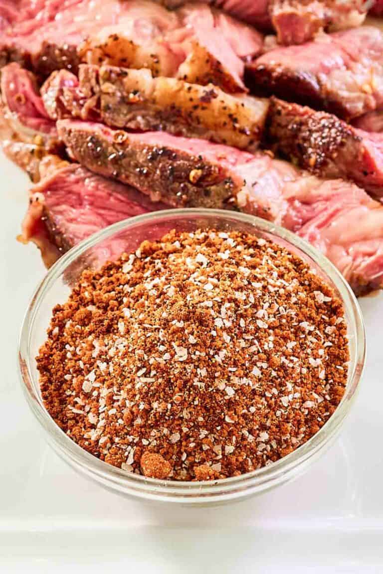 Homemade coffee rub and steak on a platter.