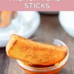 Copycat Burger King French toast stick in a small bowl of syrup.
