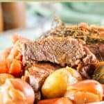 Closeup of instant pot tri tip roast and vegetables on a plate.
