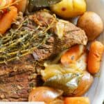 Closeup of Instant Pot tri tip roast and veggies on a platter.