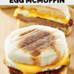 Homemade McDonald's sausage egg mcmuffin breakfast sandwich on a wood serving board.