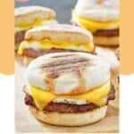 Homemade McDonald's sausage egg mcmuffin on a wood serving board.