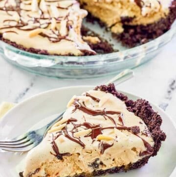 Ice cream mud pie with Oreo crust in a pie dish and a slice on a plate.