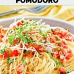 Closeup of homemade Olive Garden capellini pomodoro in a pasta bowl.