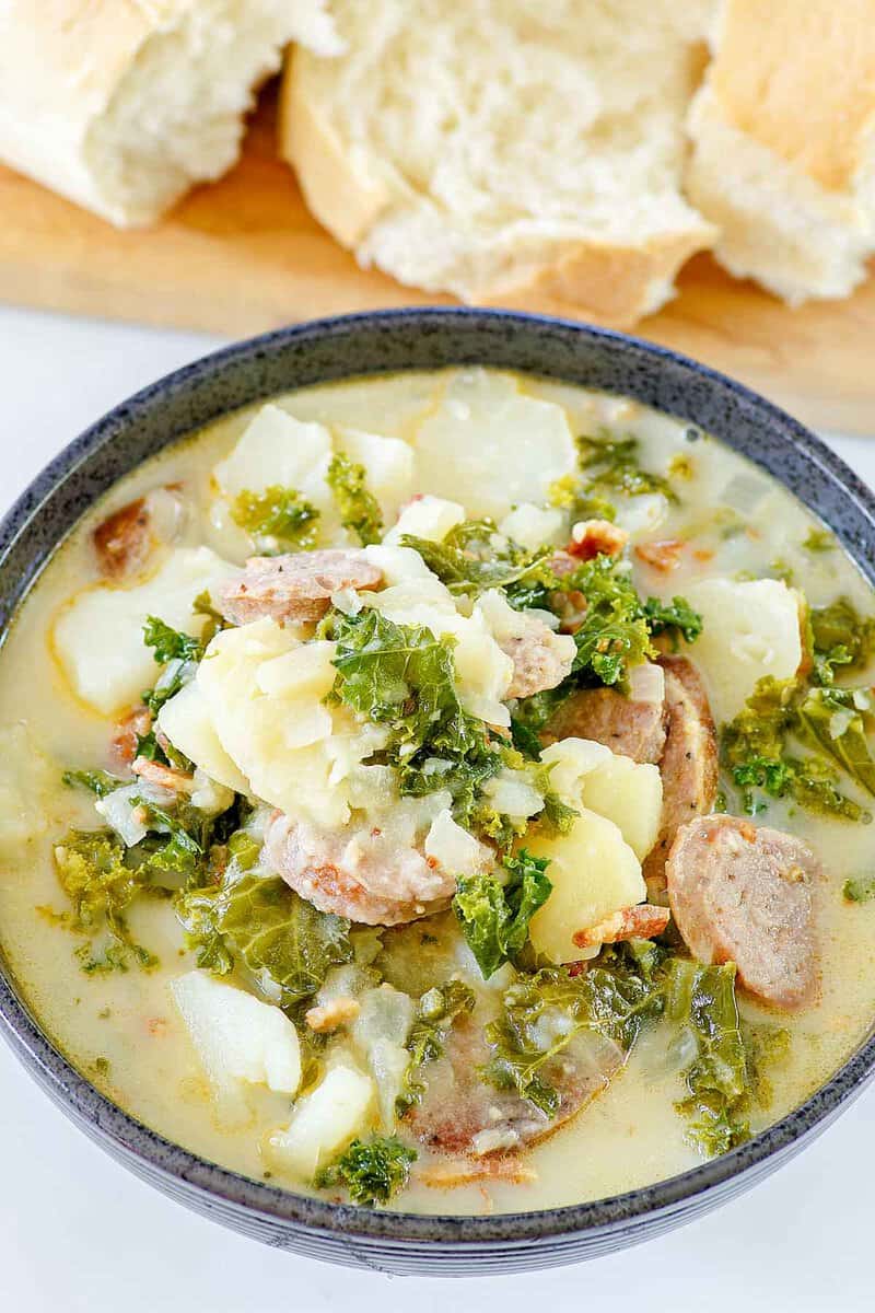 Copycat Olive Garden Zuppa Toscana soup in a black bowl.