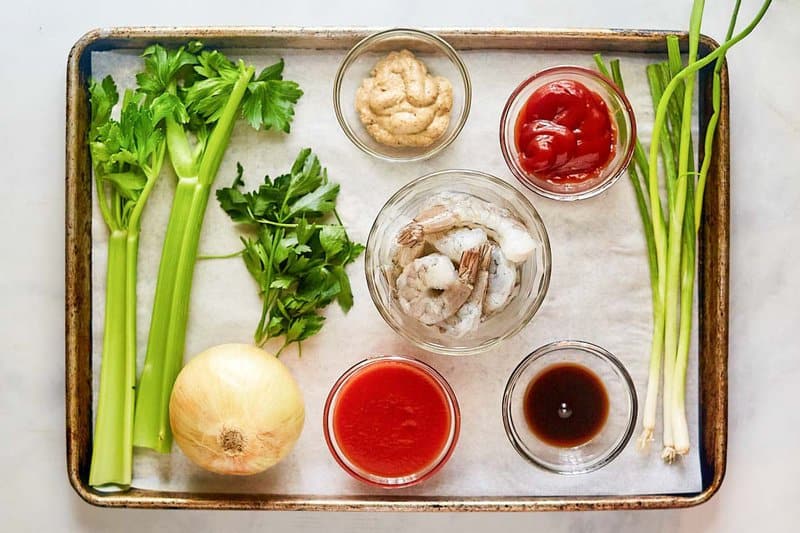 Shrimp remoulade ingredients on a tray.